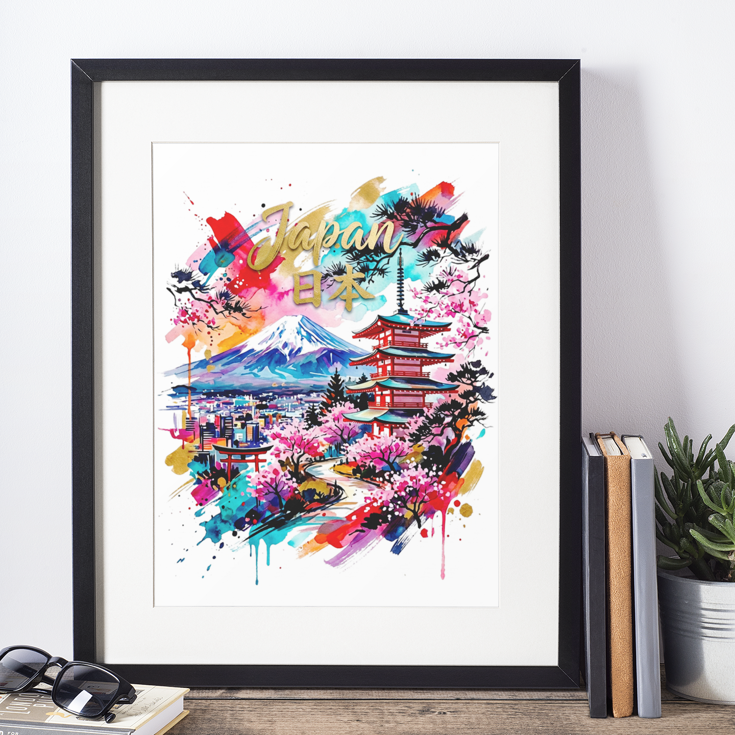 Framed colorful art print showing Mount Fuji, pagoda, cherry blossoms, and paint splatters