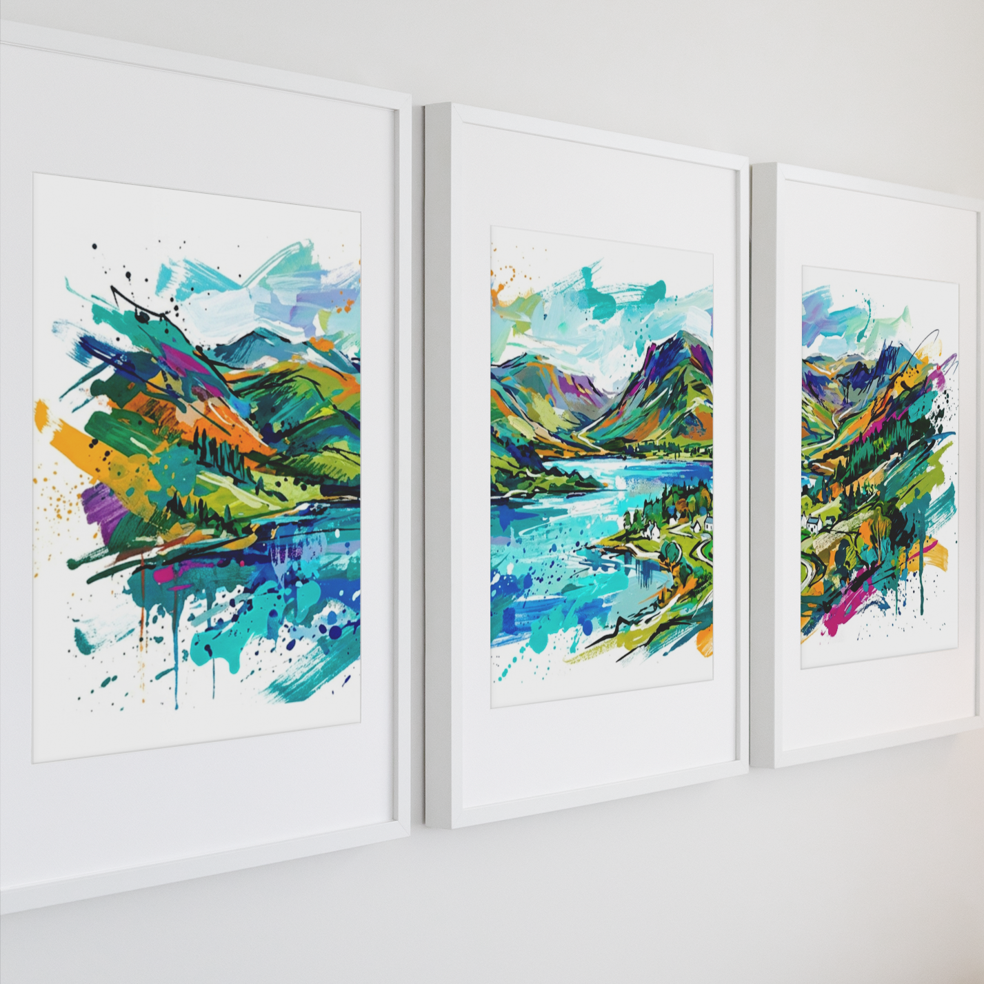 Three framed abstract landscape art prints with colorful watercolor-style mountain and lake scenes, displayed side by side on a white wall.