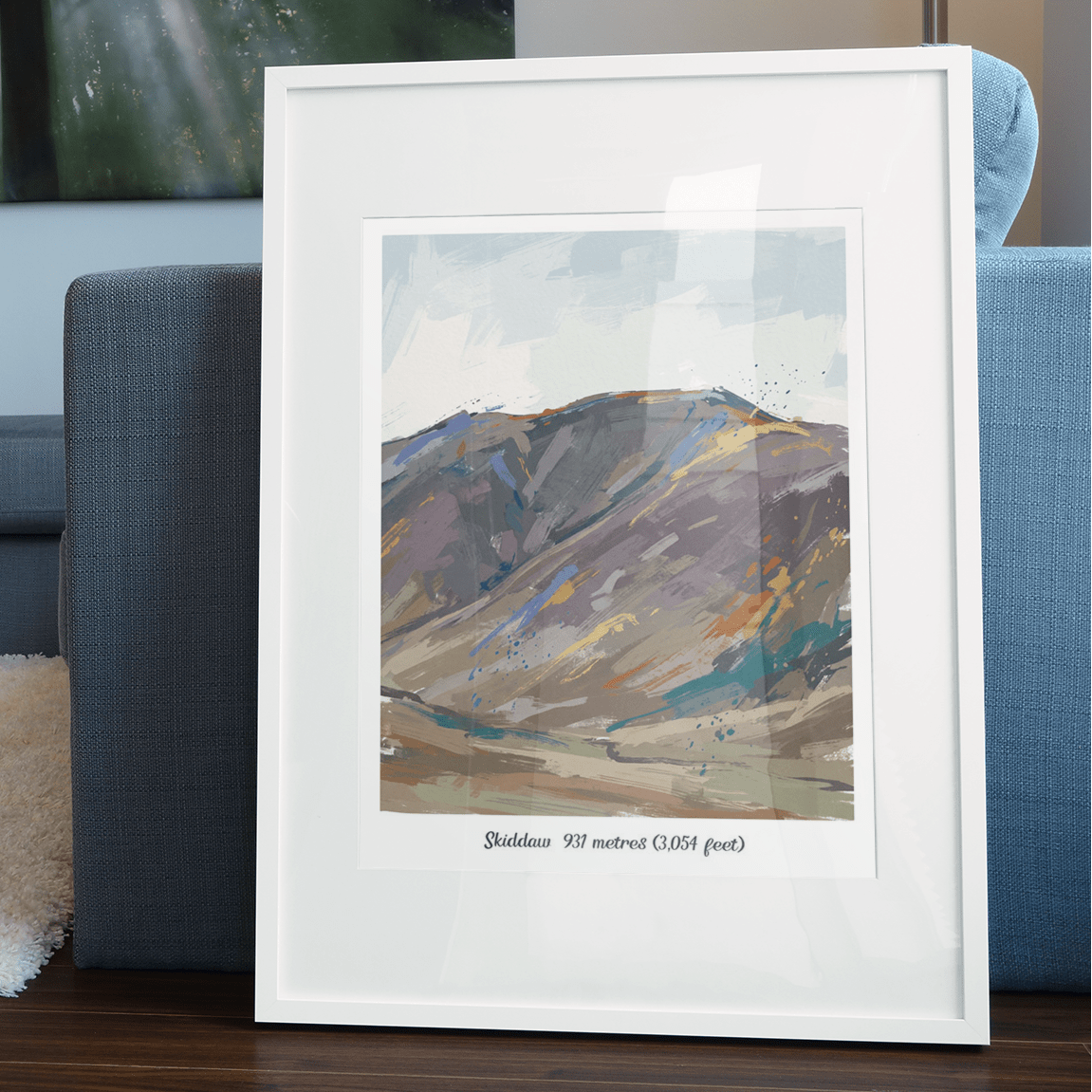 White framed vibrant abstract mountain landscape art print on living room sofa