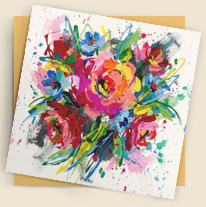 A square art print or greeting card featuring a colorful watercolor bouquet of flowers, shown with a tan envelope behind it on a warm beige background.